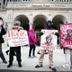 Demonstrators protest Jan. 25, 2016, outside a hearing at the Michigan Building to decide whether to order an end to an earlier sick-out by Detroit Public School teachers. Detroit teachers conducted another sick-out that shut schools May 2, 2016.
Bill Pugliano/Getty Images